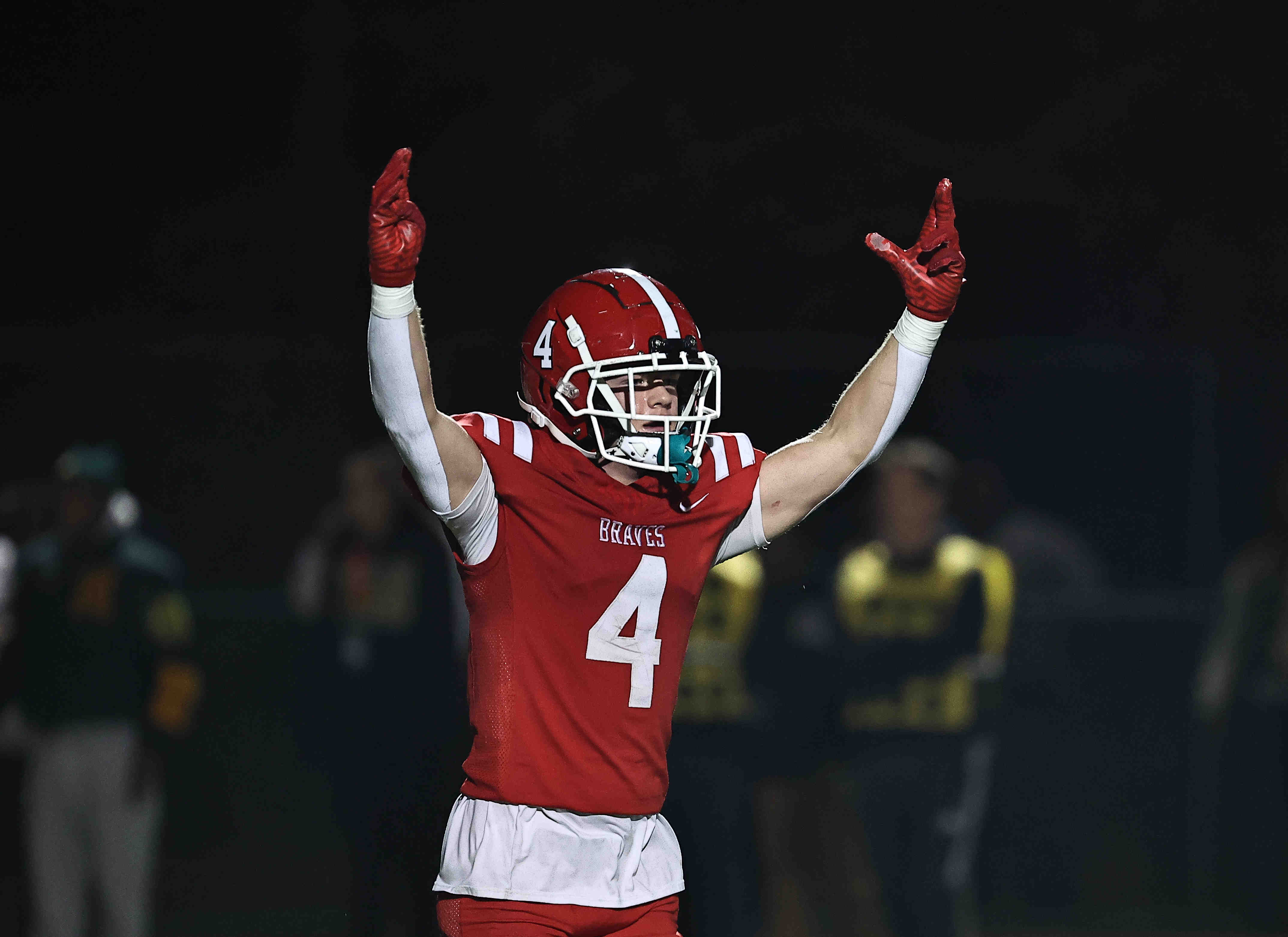 Indian Hill's Dylan Hartman (4) celebrates after the OHSAA Division IV regional semifinal game between Indian Hill and Taft Friday, Nov. 14, 2025. Indian Hill won 25-19.
