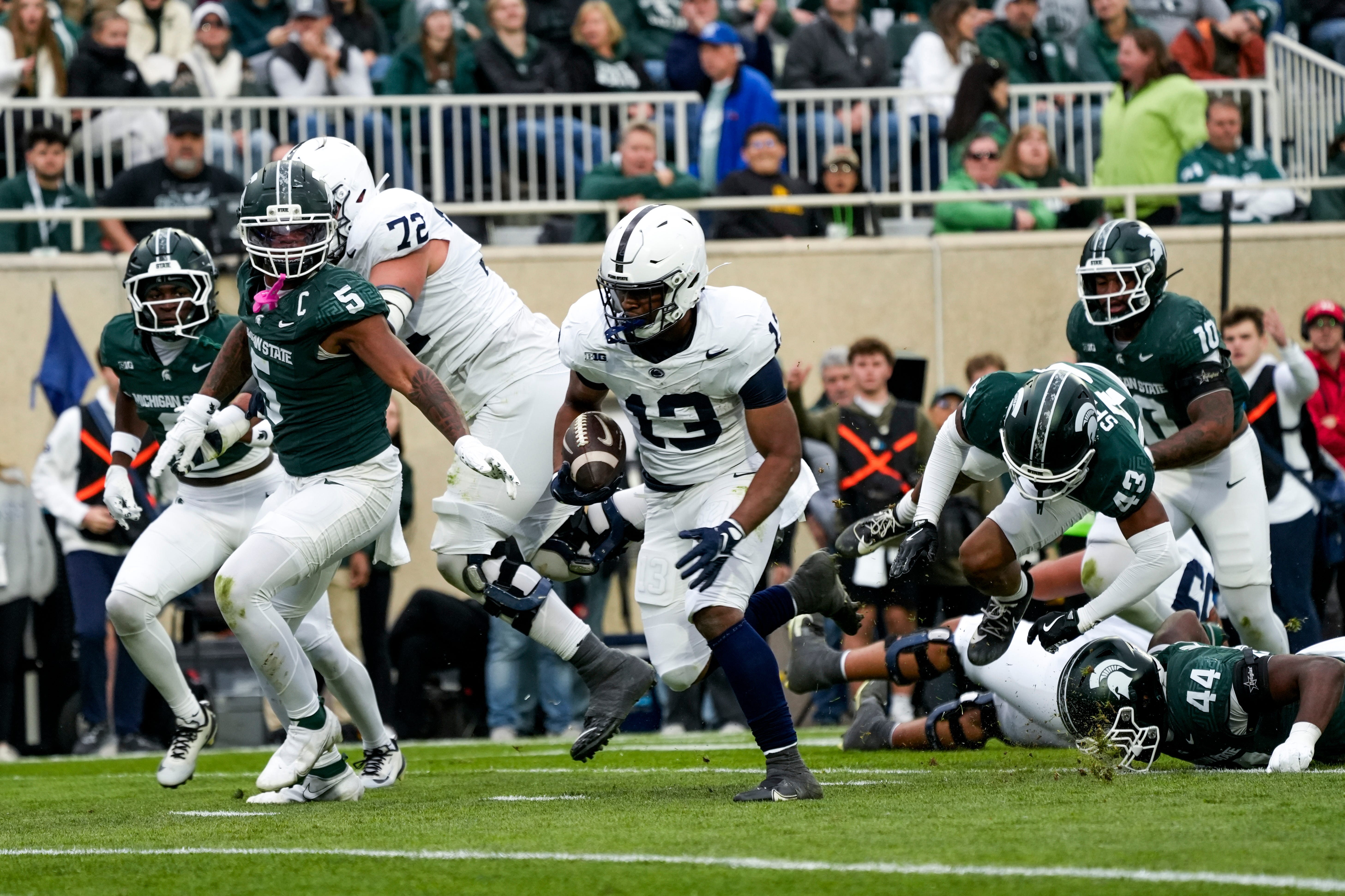 Nov 15, 2025; East Lansing, Michigan, USA; Penn State Nittany Lions running back Kaytron Allen (13) runs for a touchdown in the first quarter against the Michigan State Spartans at Spartan Stadium. Mandatory Credit: Brendan Mullin-Imagn Images