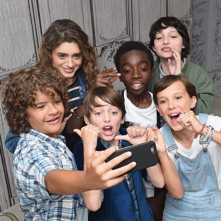 NEW YORK, NY - AUGUST 31: (L-R) Actors Gaten Matarazzo, Natalia Dyer, Noah Schnapp, Caleb McLaughlin, Finn Wolfhard and Millie Bobby Brown (front right) of "Stranger Things" attend the BUILD Series at AOL HQ on August 31, 2016 in New York City. (Photo by Michael Loccisano/Getty Images)