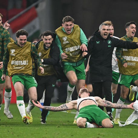 Ireland's forward #07 Troy Parrott (Bottom) celebrates his 2-3 during the FIFA World Cup 2026 Group F European qualification football match betweem Hungary and Republic of Ireland at the Puskas Arena in Budapest, Hungary on Novemeber 16, 2025.