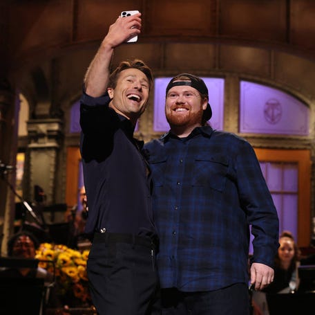 Glen Powell with UPS driver Mitch on "Saturday Night Live" on Nov. 15, 2025.
