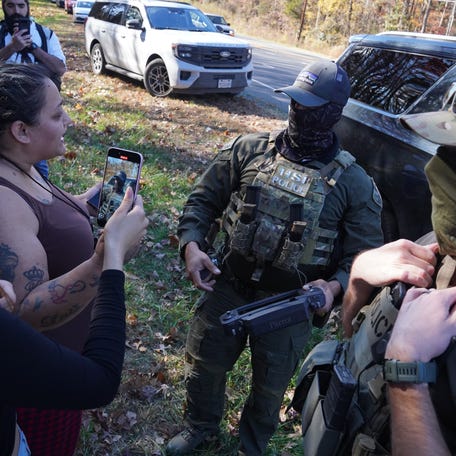 Department of Homeland Security Investigations officers search for two individuals who fled the scene after being stopped while selling flowers on the side of the road on Nov. 16, 2025 in Charlotte, N.C.. This comes on the second day of "Operation Charlotte's Web," an ongoing immigration enforcement surge across the Charlotte region.