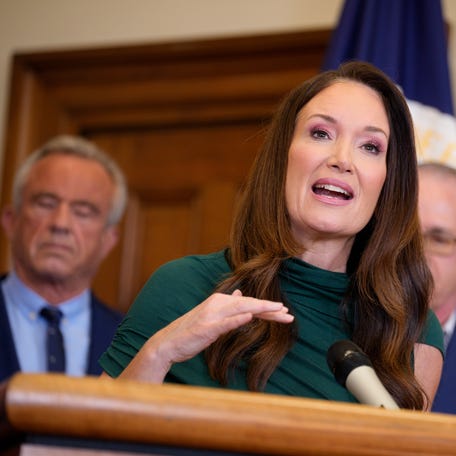U.S. Agriculture Secretary Brooke Rollins, accompanied by Health and Human Services Secretary Robert F. Kennedy Jr. (L) speaks before signing three new SNAP food choice waivers in her office at the USDA Building on June 10, 2025 in Washington, DC.