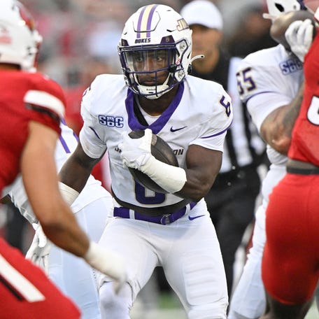 James Madison running back George Pettaway (6) carries the ball against Louisville during their game at L&N Federal Credit Union Stadium.