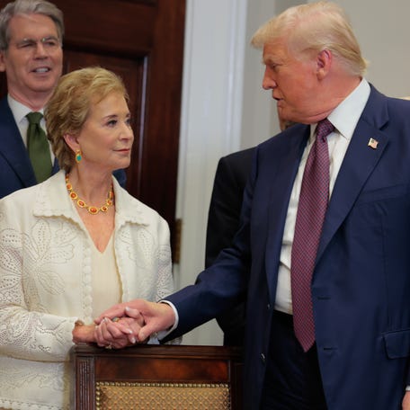 President Donald Trump speaks with Secretary of Education Linda McMahon during an executive order signing ceremony in the Roosevelt Room of the White House on July 31, 2025.