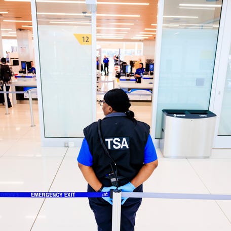 DA TSA agent stands outside a security checkpoint at Denver International Airport on November 8, 2025 in Denver, Colorado.