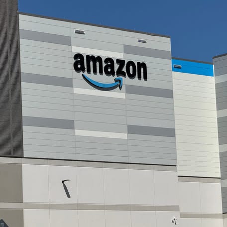 The Amazon smile logo can be seen on the front of the e-commerce giant's new five-story robotic fulfillment center at 2519 Bellevue Ave. in Daytona Beach, Florida, on Tuesday, March 11, 2025.