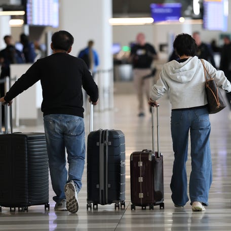 People prepare to travel out of LaGuardia Airport on October 28, 2025 in New York City.