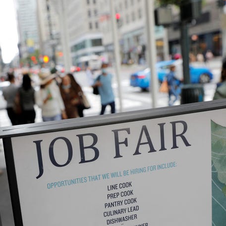 Signage for a job fair is seen on 5th Avenue in Manhattan, New York City. REUTERS/Andrew Kelly/File Photo