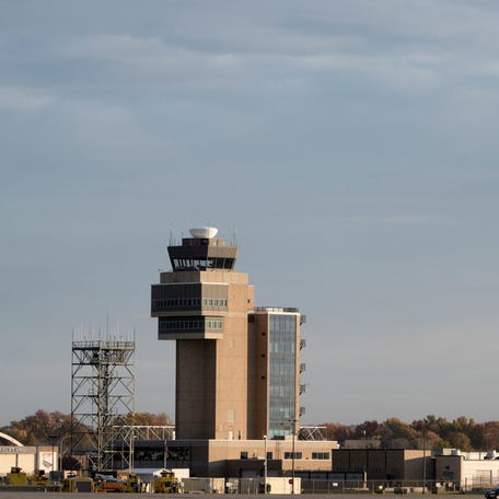 A Delta Air Lines plane passes an air traffic control tower during take off at Minneapolis–Saint Paul International Airport in Minneapolis, Minnesota, on Nov. 7, 2025.