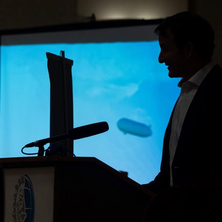 A silhouette of the Pathfinder 1 is on screen during LTA Research CEO Brett Crozier's presentation for the Akron Roundtable in Akron, Ohio, on Nov. 20, 2025.