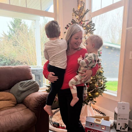 Josie Bradley of Snohomish, Washington, and her family have decided not to exchange Christmas gifts this year. Bradley, shown with two of her grandchildren, said the family will spend time putting on a talent show instead.
