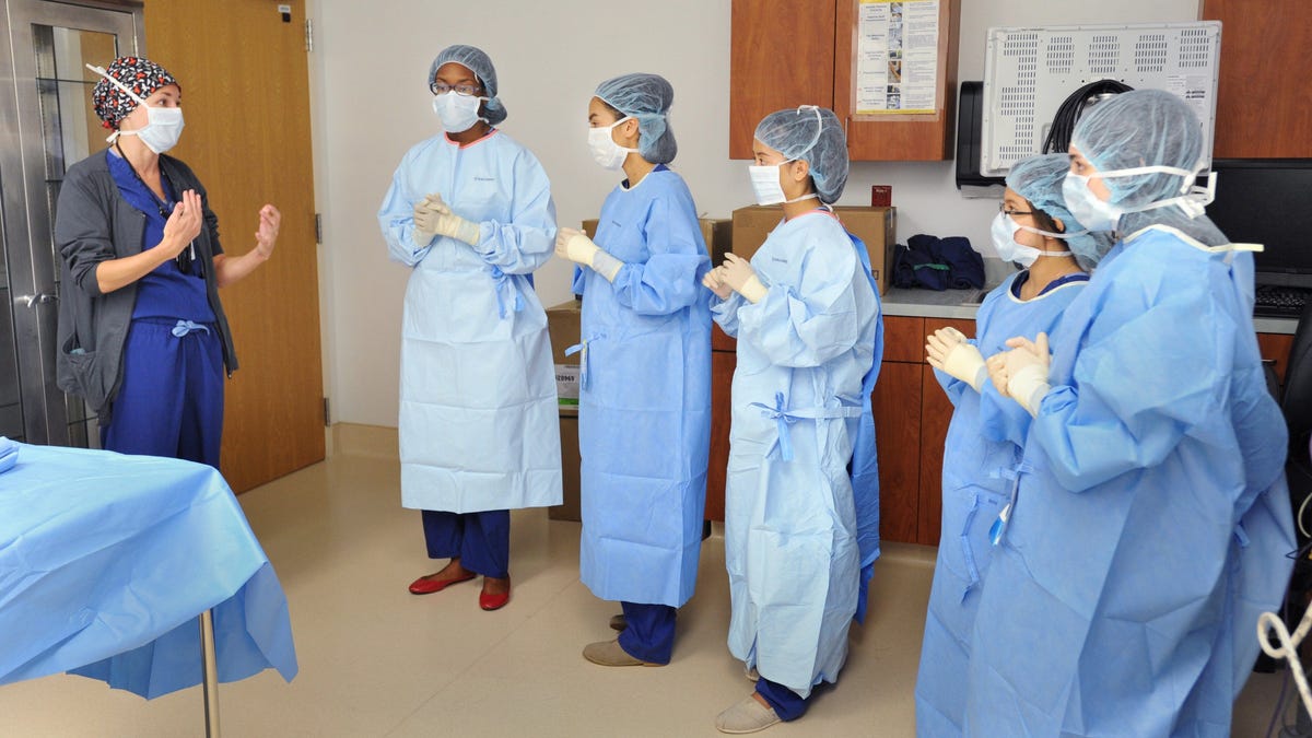 Lt. Jaime York (left) a registered nurse, talks with students from Darnell-Cookman School of the Medical Art at Naval Hospital Jacksonville in this 2016 photo. The Education Department is set to cap how much nurses can borrow to fund their education.