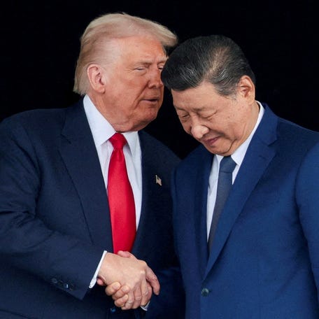 President Donald Trump and Chinese President Xi Jinping talk as they leave after a bilateral meeting at Gimhae International Airport, on the sidelines of the Asia-Pacific Economic Cooperation (APEC) summit, in Busan, South Korea, October 30, 2025.