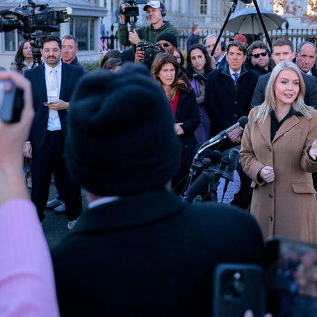 Press secretary Karoline Leavitt speaks to reporters outside the White House on Nov. 24, 2025.