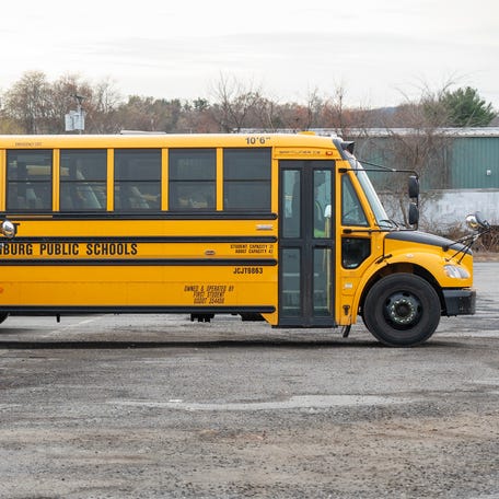 A school bus is backed into a parking spot at the First Student Inc. lot on Airport Road in Fitchburg Nov. 25.