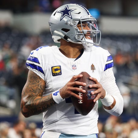 Nov 23, 2025; Arlington, Texas, USA; Dallas Cowboys quarterback Dak Prescott (4) warms up before the game against the Philadelphia Eagles at AT&T Stadium.
