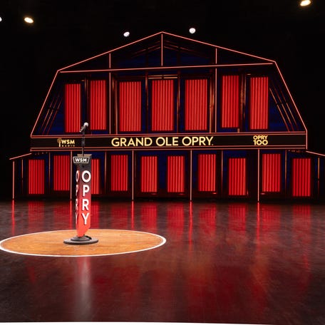 The Opry stage features a circle of wood cut from the stage of the Ryman Auditorium, its former home.