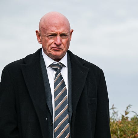 U.S. Senator Mark Kelly, D-Arizona, looks on at a news conference calling for the release of the Epstein files, on Capitol Hill on Nov. 18, 2025.