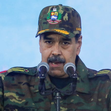 Venezuelan President Nicolas Maduro is pictured holding Simon Bolivar's sword as he speaks during a rally at the Fort Tiuna military base in Caracas, Venezuela, on Nov. 25, 2025.