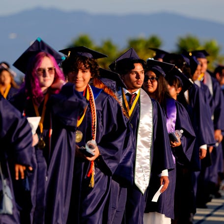 High school graduates take part in the commencement ceremony in Desert Hot Springs, California, on May 30, 2025.