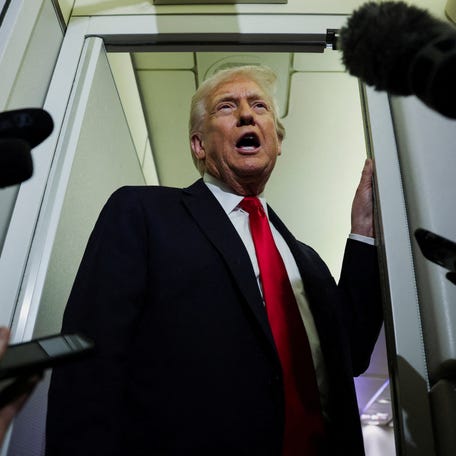 President Donald Trump speaks to reporters aboard Air Force One on his way to Palm Beach, Florida, on Nov. 25, 2025.