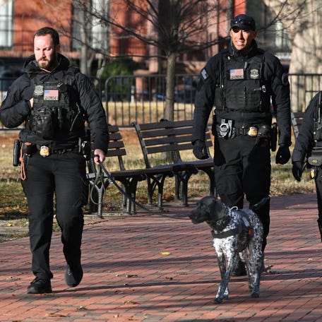 Secret Service uniformed division officers patrol in Lafayette Square across from the White House on Nov. 27, 2025.