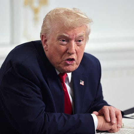 U.S. President Donald Trump speaks with members of the media following a call with military service members, on Thanksgiving, in Palm Beach, Florida, November 27, 2025.