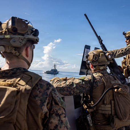 U.S. Marines keep watch during a strait transit while underway in the Caribbean Sea, November 18, 2025. Sgt. Nathan Mitchell/U.S. Marine Corps/Handout via REUTERS THIS IMAGE HAS BEEN SUPPLIED BY A THIRD PARTY