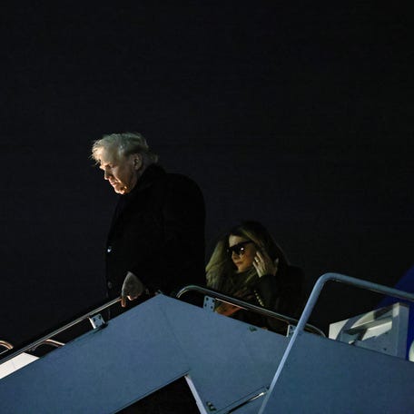 President Donald Trump, with first lady Melania Trump, disembarks from Air Force One upon arrival from Florida, at Joint Base Andrews, in Maryland, U.S., November 30, 2025. REUTERS/Anna Rose Layden