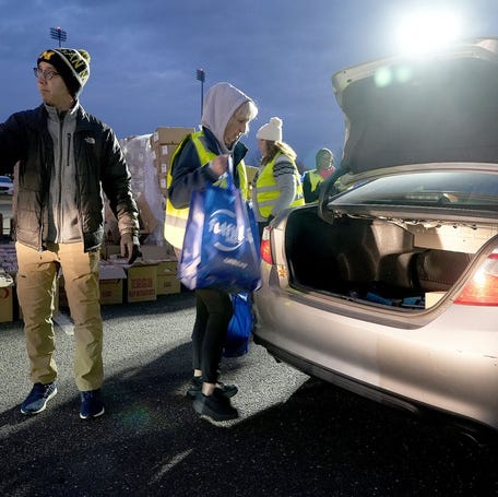 With SNAP food assistance benefits suspended during the government shutdown, food is loaded into a car trunk during a food distribution sponsored by Fulfill for 1000 people in the parking lot at ShoreTown Ballpark in Lakewood late Wednesday afternoon November 12, 2025.