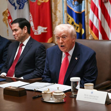 President Donald Trump, flanked by Secretary of State Marco Rubio and Secretary of Defense Pete Hegseth, speaks during a Cabinet Meeting in the Cabinet Room of the White House in Washington, DC on Dec. 2, 2025.