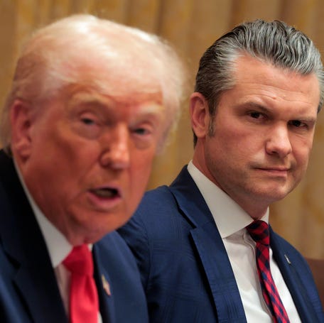 Defense Secretary Pete Hegseth looks on as President Donald Trump speaks during his Cabinet meeting at the White House on Dec. 2, 2025, in Washington, DC.