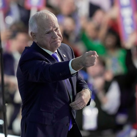Minnesota Gov. Tim Walz, the Democratic vice presidential nominee, acknowledges the crowd after delivering his acceptance speech during the Democratic National Convention on Aug. 21, 2024, in Chicago.
