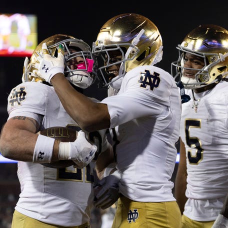 Notre Dame Fighting Irish running back Aneyas Williams (22) celebrates with Notre Dame Fighting Irish tight end Ty Washington (7) after scoring a touchdown during the fourth quarter against the Stanford Cardinal at Stanford Stadium.