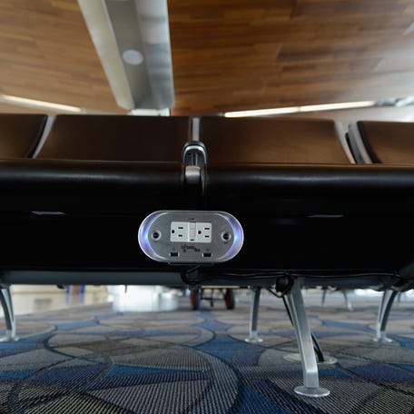 Many airports, like Los Angeles International Airport, offer power outlets easily within travelers' reach.