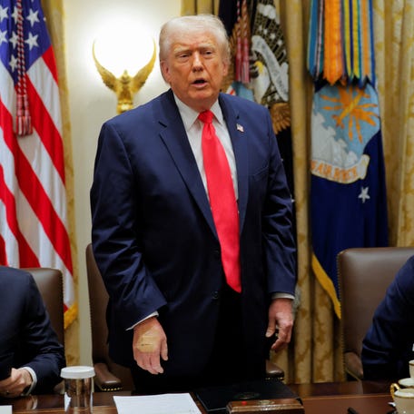 President Donald Trump, wearing band-aids on his hand, attends a cabinet meeting at the White House in Washington, D.C., on Dec. 2, 2025.