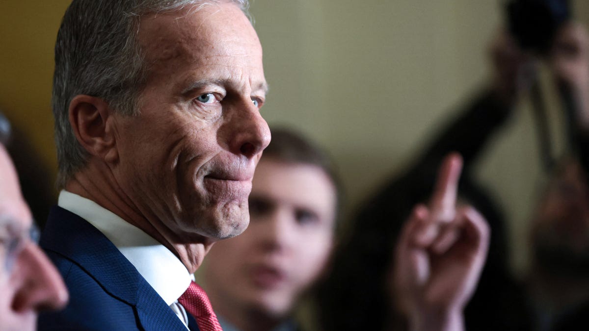 Senate Majority Leader John Thune addresses reporters after the weekly Senate Republican caucus policy luncheon at the Capitol in Washington on Dec. 2.