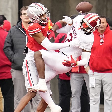 Ohio State cornerback Davison Igbinosun (1) defends on a throw to Indiana wide receiver Omar Cooper Jr. (3) during their 2024 game at Ohio Stadium in Columbus.