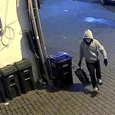 A surveillance photo released by the FBI shows a person in Washington, DC, the night before the U.S. Capitol attack on Jan. 6, 2021. The FBI issued a notice, which features this surveillance photo, requesting information on person(s) responsible for pipe bombs left at the Republican National Committee (RNC) and Democratic National Committee (DNC) headquarters.