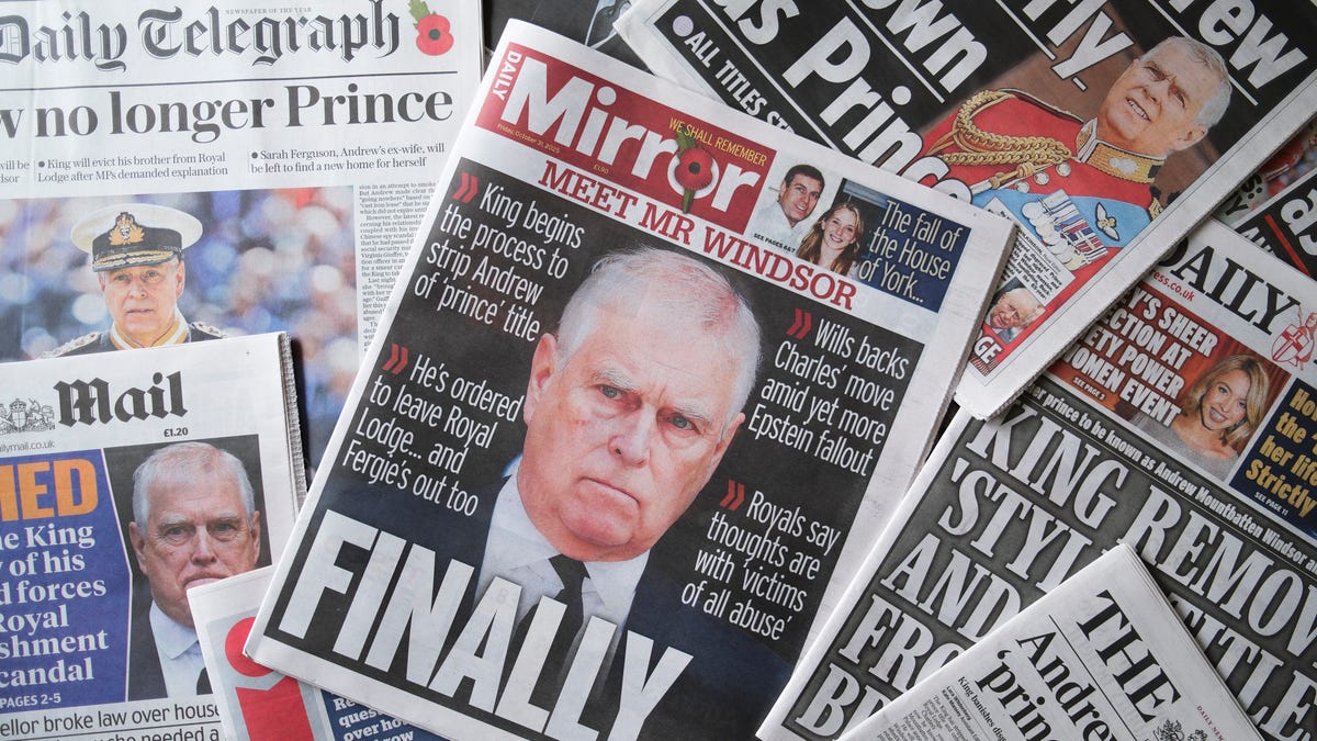 WINDSOR, ENGLAND - OCTOBER 31: In this photo illustration, the front page of the Daily Mirror newspaper with an image of Andrew Mountbatten Windsor is seen on October 31, 2025 in Windsor, England. King Charles III has started the formal process of removing the Titles, Styles and Honours of his brother, who will now be known as Andrew Mountbatten Windsor. Mr Mountbatten Windsor will also surrender the lease on Royal Lodge, where he has lived since 2004, and move to private accommodation.   The historic move follows allegations of sexual abuse linked to the former prince's relationship with child sex offender Jeffrey Epstein. (Photo Illustration by Ming Yeung/Getty Images)