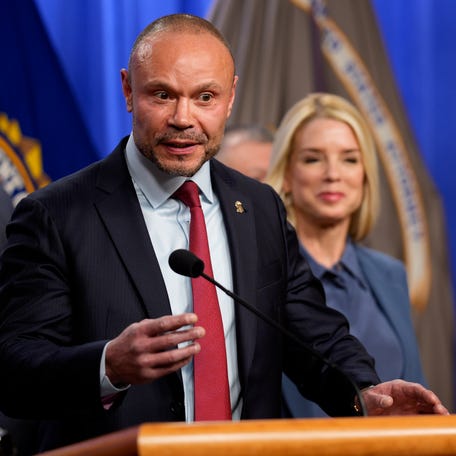 FBI Deputy Director Dan Bongino, with Attorney General Pam Bondi and FBI Director Kash Patel, speaks during a news conference on Dec. 4, 2025, in Washington, DC, announcing that a person has been arrested for allegedly planting pipe bombs ahead of the U.S. Capitol attack on Jan. 6, 2021. The pipe bombs were placed near the offices of the Democratic and Republican national committees but did not detonate.