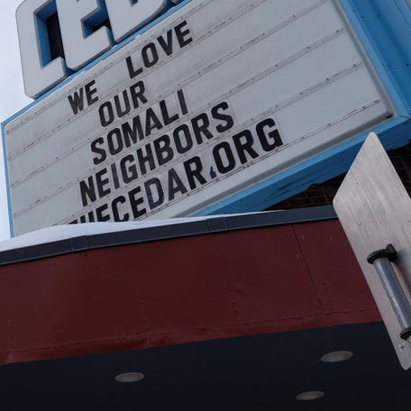 A sign reading "We love our Somali neighbors" lines a marquee amid reports of a federal immigration operation targeting the Somali community in Minneapolis in December 2025.