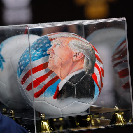 A detailed view of a soccer ball with a painted face of U.S. President Donald Trump ahead of the FIFA World Cup 2026 Final Draw at John F. Kennedy Center for the Performing Arts. Mandatory Credit: Brian Snyder-Reuters via Imagn Images