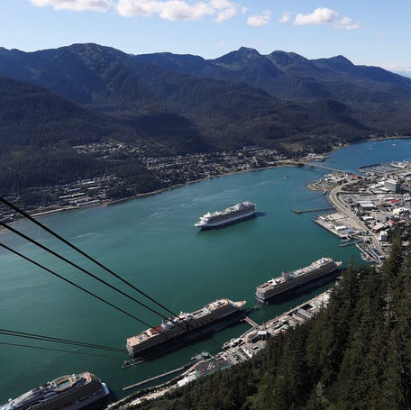 Cruise ships are docked in this mountain view of downtown Juneau and the Gastineau Channel in Juneau, Alaska, on Aug. 27, 2023.