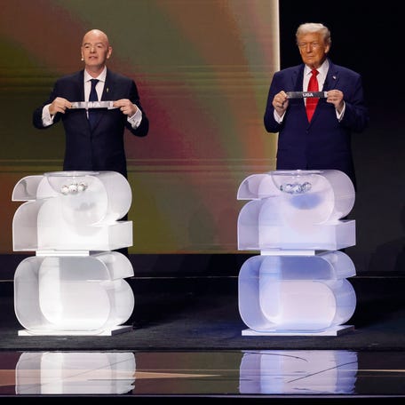 FIFA president Gianni Infantino, United States president Donald Trump, Mexico president Claudia Sheinbaum, and Canada prime minister Mark Carney on stage during the FIFA World Cup 2026 Final Draw at John F. Kennedy Center for the Performing Arts.