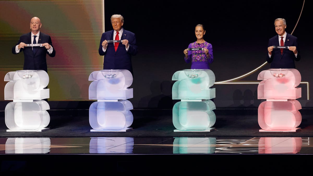 FIFA president Gianni Infantino, United States president Donald Trump, Mexico president Claudia Sheinbaum, and Canada prime minister Mark Carney on stage during the FIFA World Cup 2026 Final Draw at John F. Kennedy Center for the Performing Arts.
