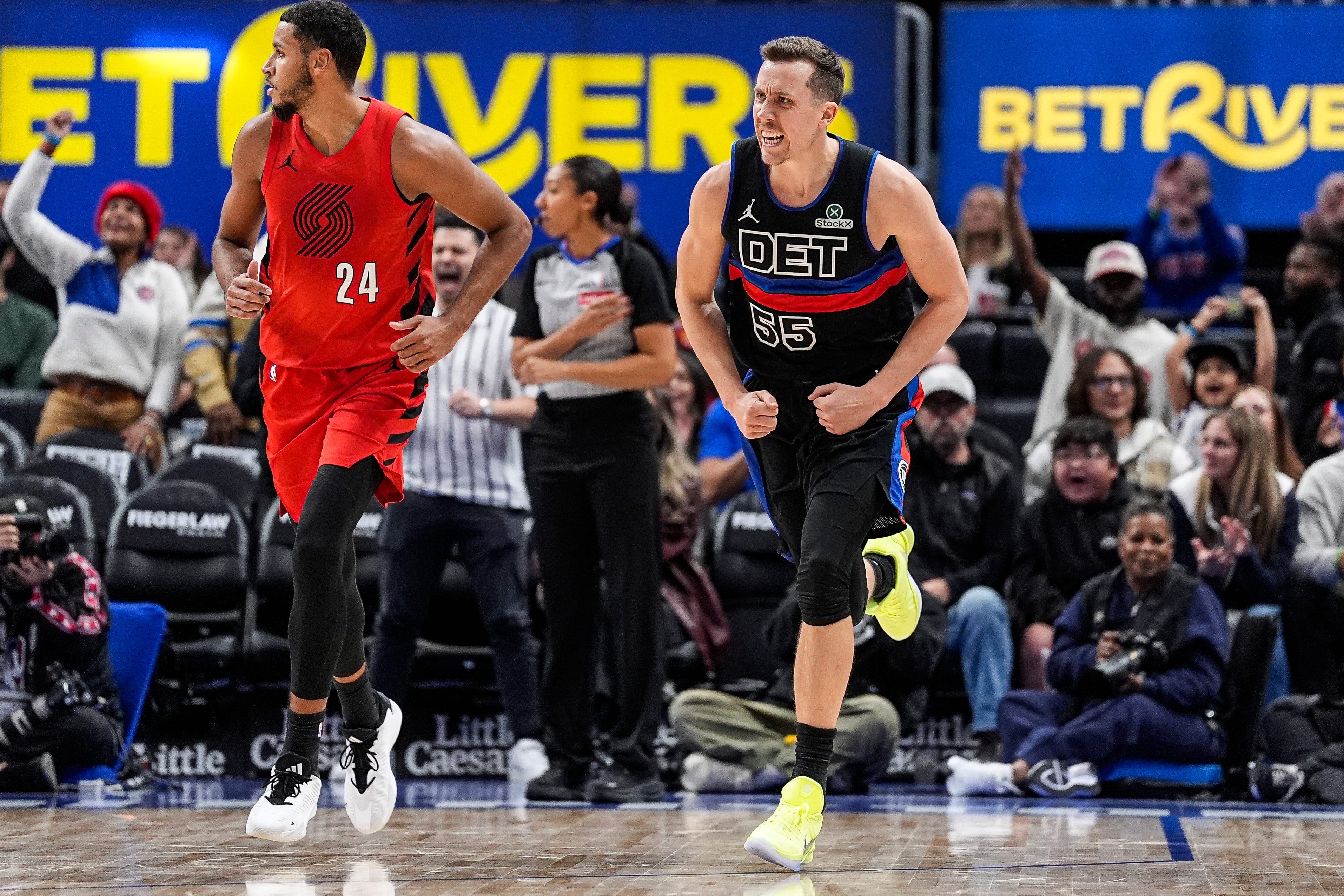 Detroit Pistons forward Duncan Robinson (55) celebrates a 3-pointer against Portland Trail Blazers during the second half at Little Caesars Arena in Detroit on Friday, Dec. 5, 2025.