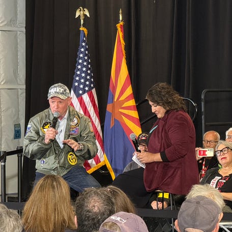 Sen. Mark Kelly discusses an array of issues with Democratic congressional candidate JoAnna Mendoza during a town hall in Tucson's Second Sky, a community social club, on Dec. 5, 2025.
