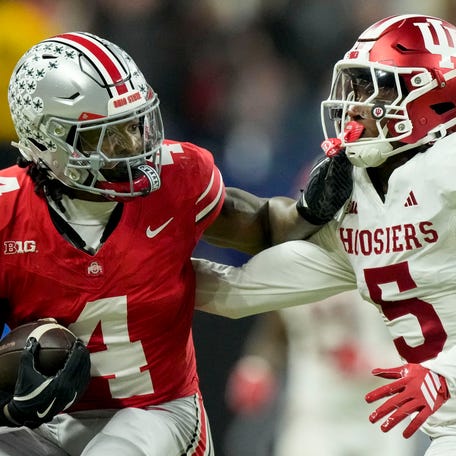 Ohio State Buckeyes wide receiver Jeremiah Smith (4) pushes off of Indiana Hoosiers defensive back D'Angelo Ponds (5) on Saturday, Dec. 6, 2025, during the Big Ten football championship at Lucas Oil Stadium in Indianapolis.